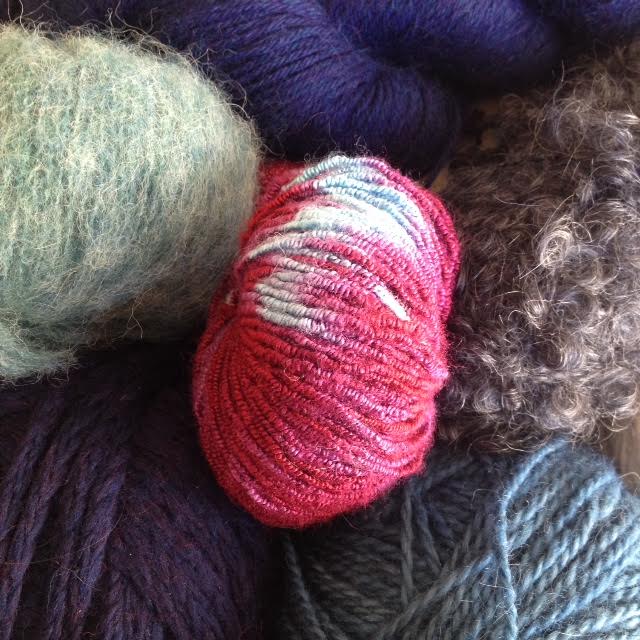 balls and skeins of different kinds of yarn